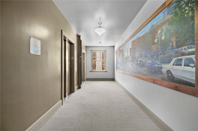 corridor featuring light carpet