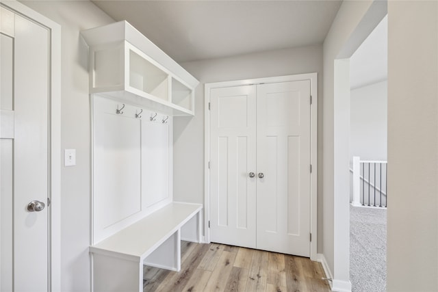 mudroom with light hardwood / wood-style flooring