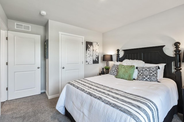 bedroom featuring baseboards, visible vents, and carpet flooring