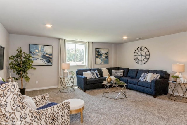 carpeted living area featuring recessed lighting, visible vents, and baseboards