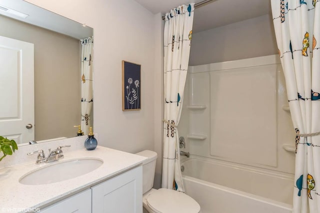 bathroom with visible vents, vanity, toilet, and shower / bath combo with shower curtain