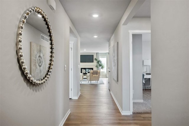 hallway featuring hardwood / wood-style flooring