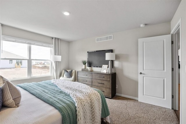 bedroom with light carpet