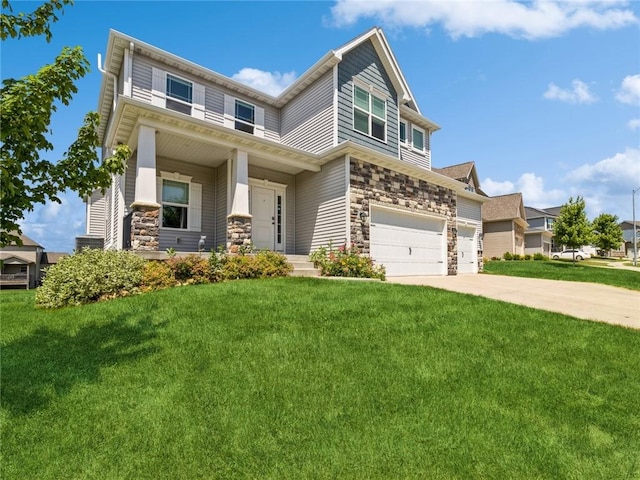 craftsman-style home with a front yard and a garage