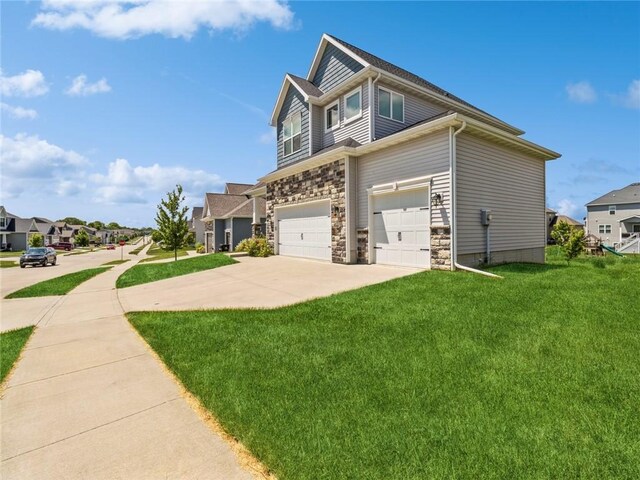 view of side of property with a garage and a yard