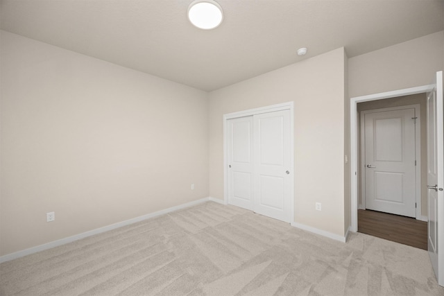 9020 Mockingbird Dr, West Des Moines, IA 50266 - unfurnished bedroom featuring carpet floors, baseboards, and a closet