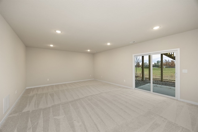 empty room with light colored carpet