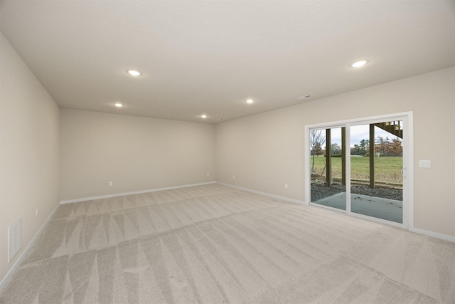 9020 Mockingbird Dr, West Des Moines, IA 50266 - spare room with light carpet, baseboards, and recessed lighting