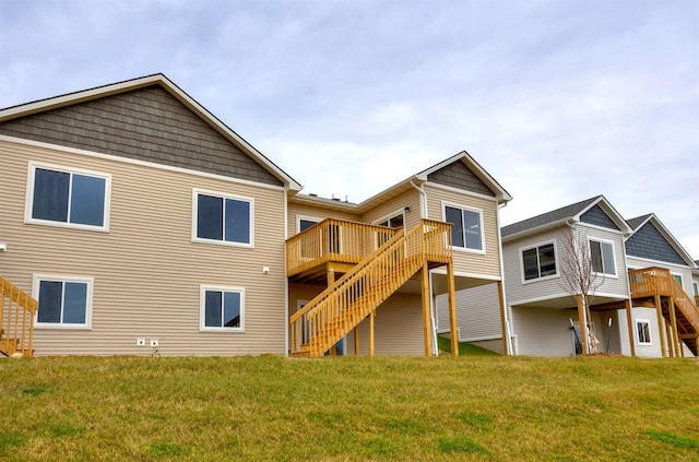 9020 Mockingbird Dr, West Des Moines, IA 50266 - rear view of house with stairway, a wooden deck, and a lawn