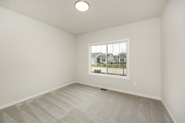 empty room featuring carpet flooring