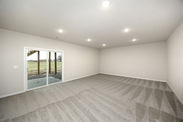 empty room featuring light carpet