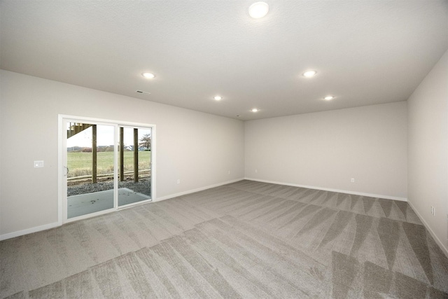 9042 Mockingbird Dr, West Des Moines, IA 50266 - carpeted spare room featuring baseboards and recessed lighting