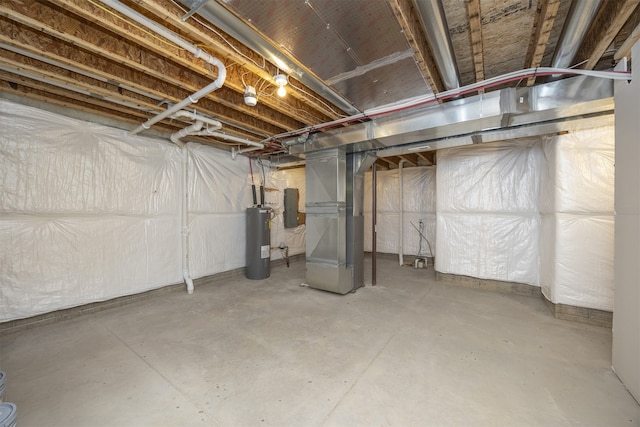 basement with electric water heater and heating unit