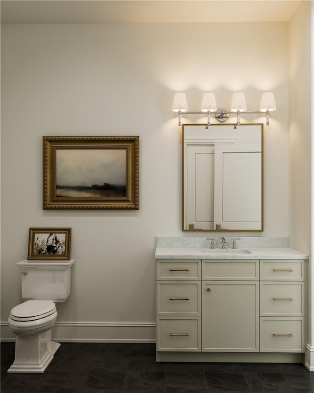 bathroom with toilet, tile floors, and large vanity