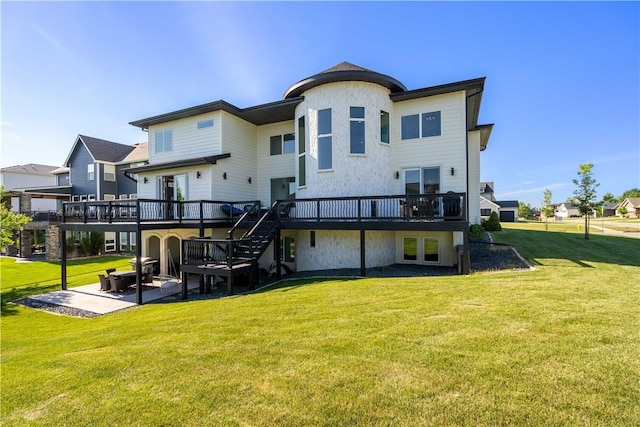 back of property featuring stairway, a yard, a patio area, and a wooden deck