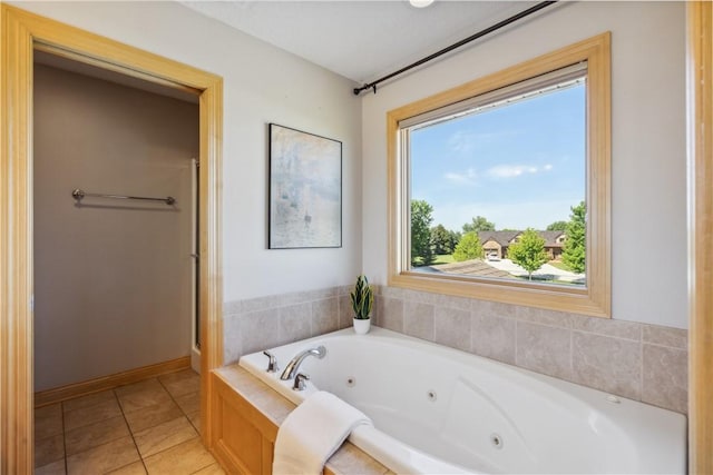 bathroom with tile patterned flooring and independent shower and bath