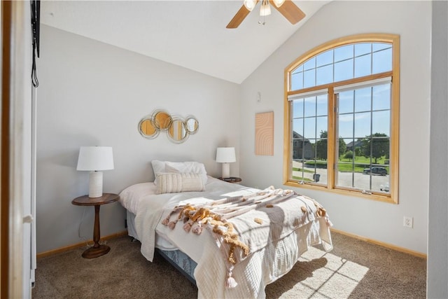 carpeted bedroom with ceiling fan and vaulted ceiling