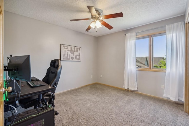 office with carpet, ceiling fan, and a textured ceiling