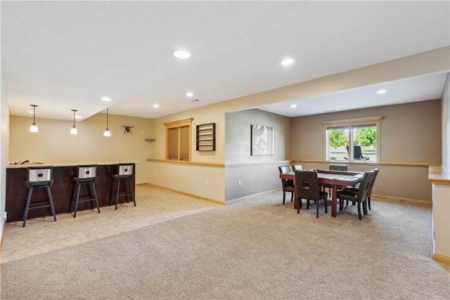 view of carpeted dining area