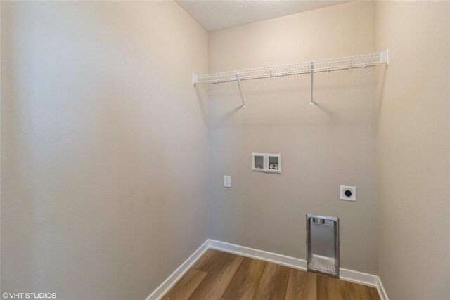 washroom featuring washer hookup, hardwood / wood-style floors, and electric dryer hookup