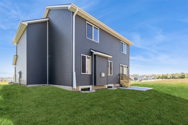 rear view of house with a lawn