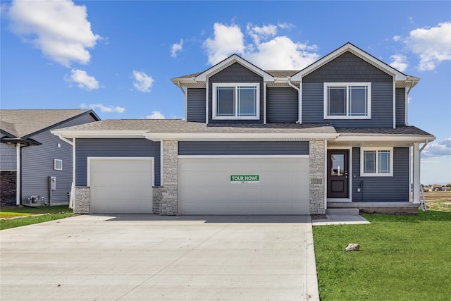 view of front facade with a garage and a front yard