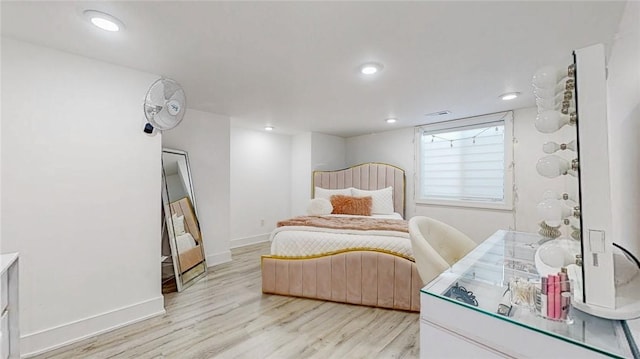 bedroom with recessed lighting, baseboards, and light wood finished floors