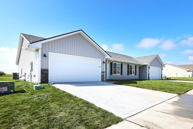 single story home with an attached garage, central AC unit, board and batten siding, driveway, and a front lawn