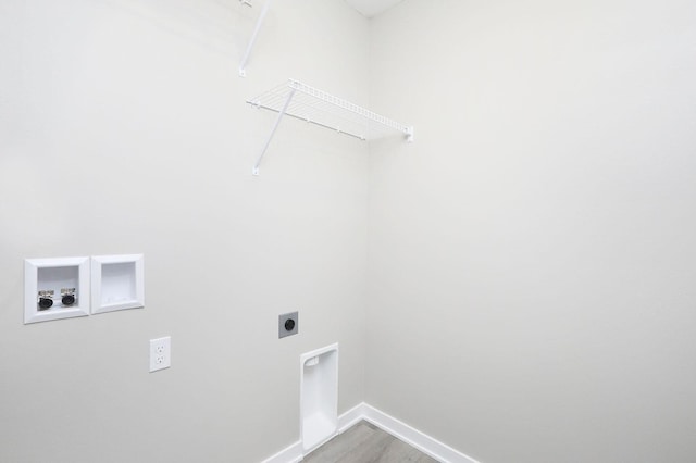 washroom with hookup for an electric dryer, laundry area, washer hookup, wood finished floors, and baseboards