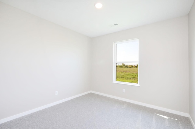 unfurnished room with carpet floors, baseboards, and recessed lighting