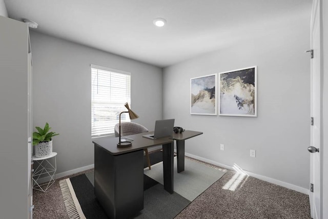 home office featuring dark carpet and baseboards