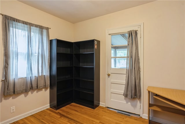 spare room featuring light hardwood / wood-style flooring