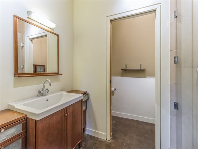 bathroom with a shower and vanity