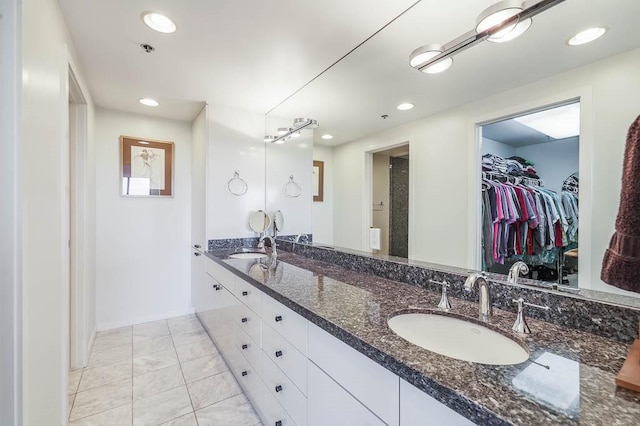 bathroom featuring tile patterned floors and vanity