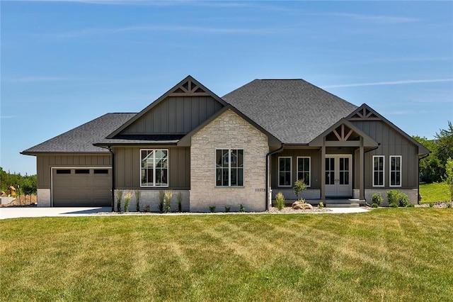 craftsman inspired home with a garage, concrete driveway, board and batten siding, and french doors