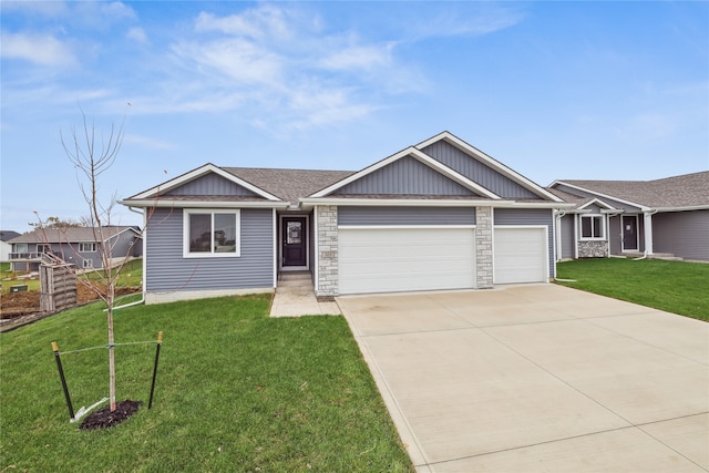 view of front of home with a garage and a front lawn