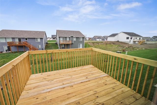 wooden deck with a yard