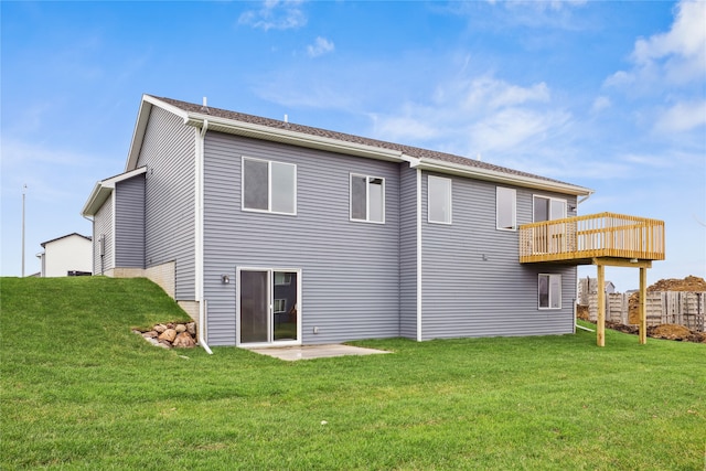 back of house with a yard and a patio