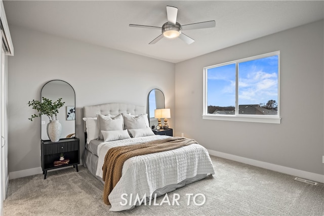 carpeted bedroom featuring ceiling fan