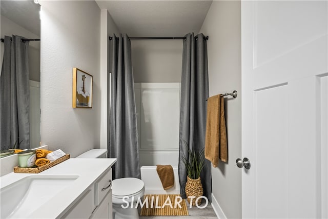 bathroom featuring hardwood / wood-style floors, vanity, a shower with shower curtain, and toilet