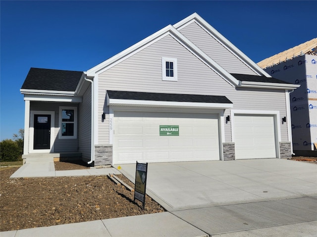 craftsman house with a garage