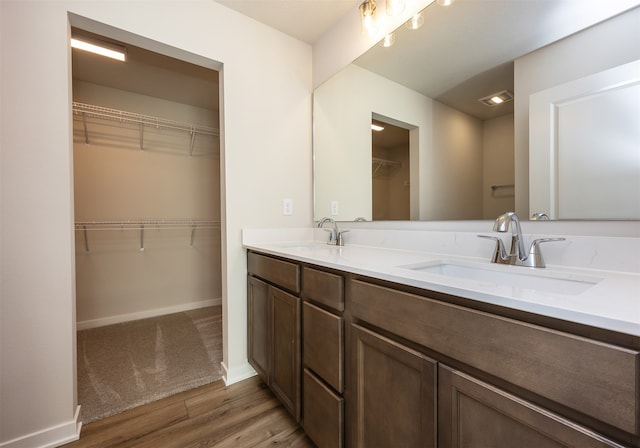 bathroom with vanity and hardwood / wood-style flooring