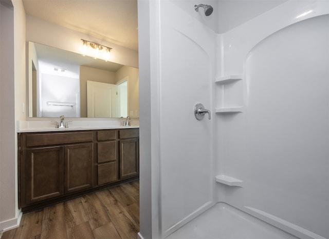 bathroom featuring hardwood / wood-style floors and vanity