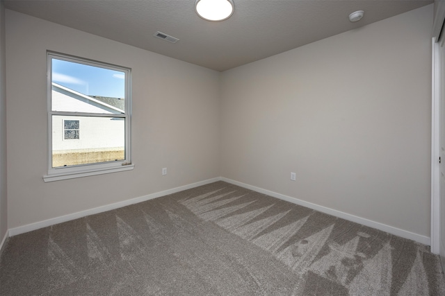 empty room with carpet flooring