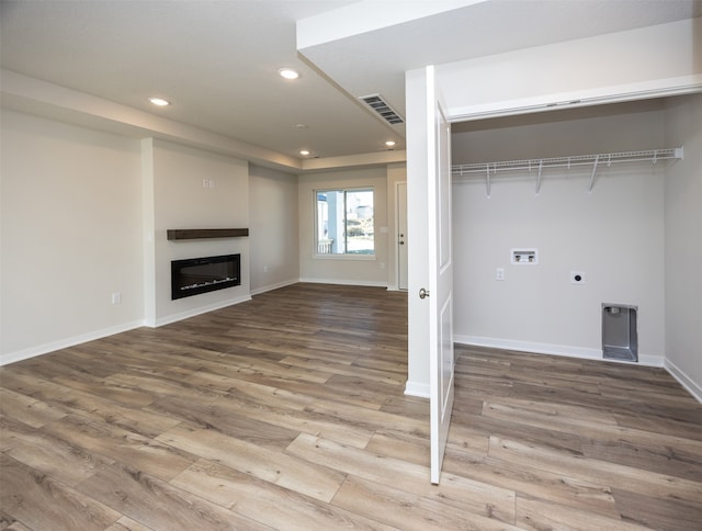 washroom featuring electric dryer hookup, washer hookup, and wood-type flooring