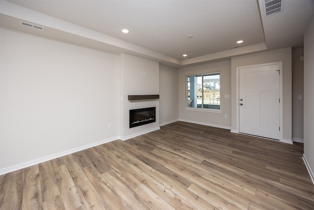 unfurnished living room featuring light wood-type flooring