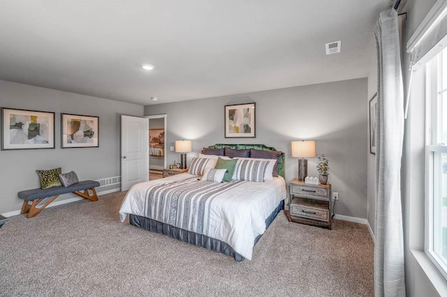 bedroom with visible vents, carpet, and baseboards