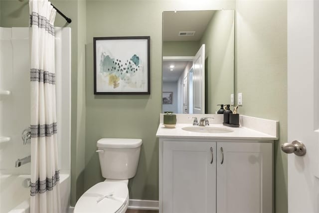 full bathroom with toilet, vanity, and shower / bath combo with shower curtain