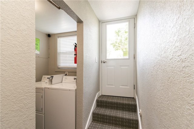 washroom with washing machine and dryer