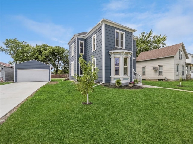 view of front facade featuring an outbuilding, a front lawn, and a garage